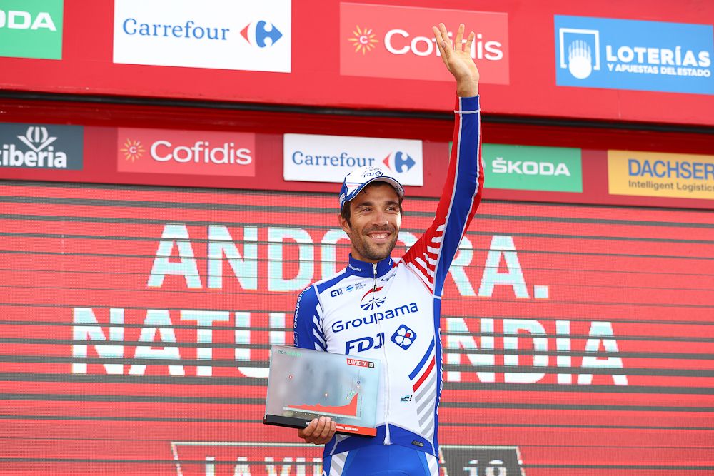 Thibaut Pinot celebrates on the Vuelta podium after winning stage 19