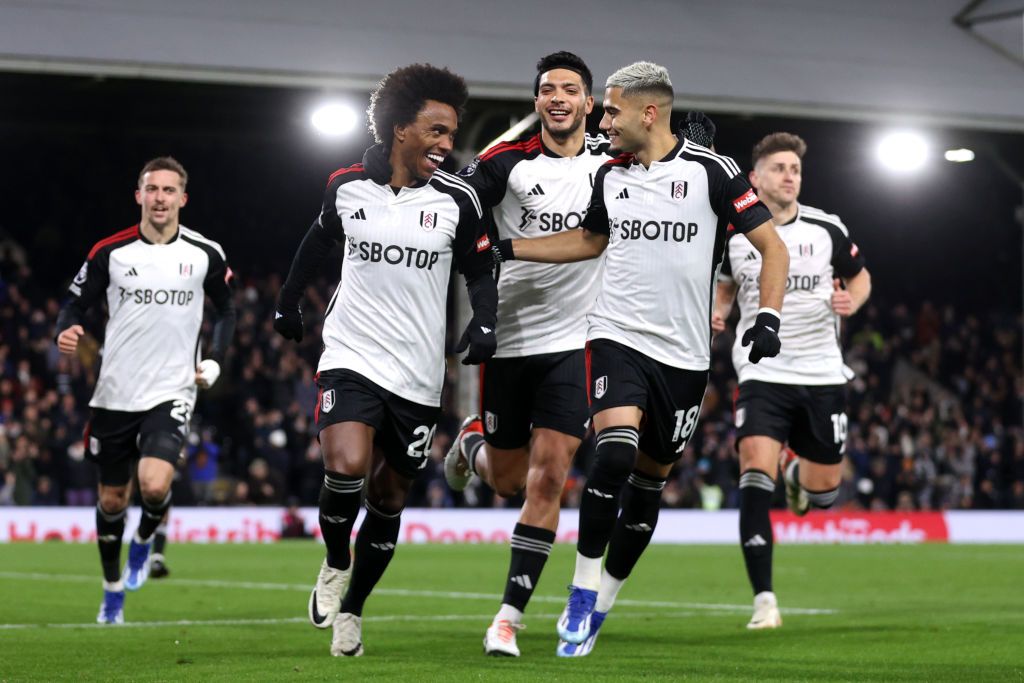 Willian of Fulham celebrates after scoring the team&#039;s second goal from a penalty kick with teammates during the Premier League match between Fulham FC and Wolverhampton Wanderers at Craven Cottage on November 27, 2023 in London, England.