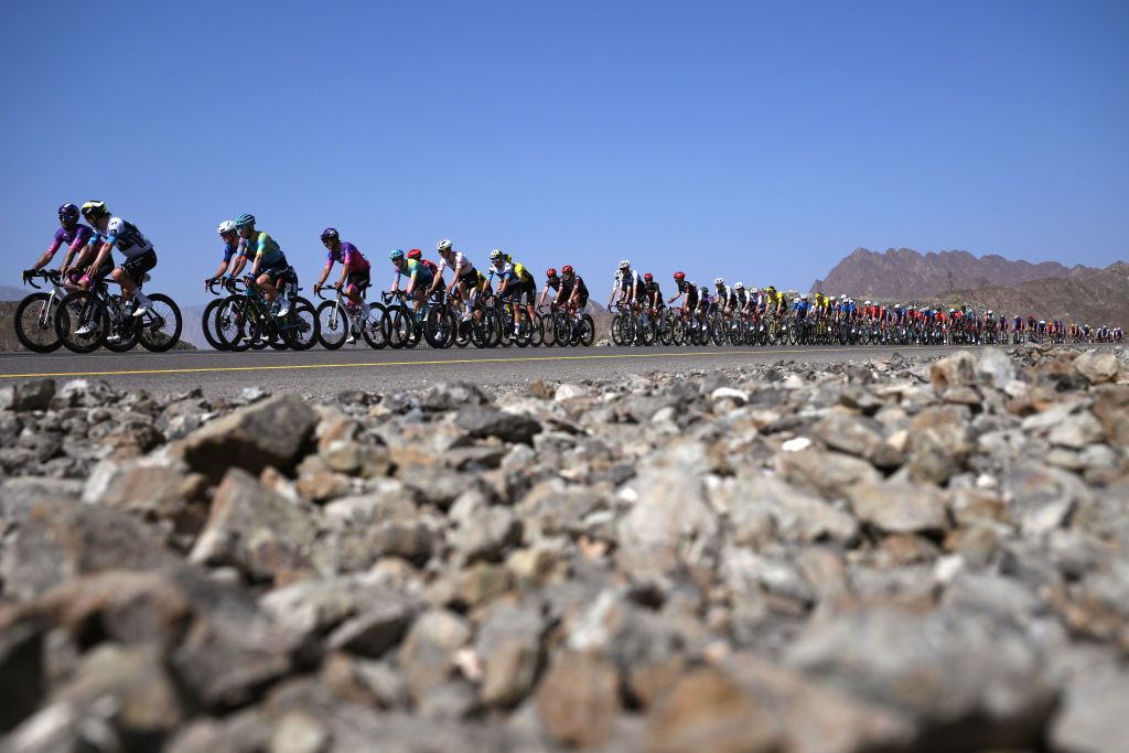 YITTI HILLS OMAN FEBRUARY 09LR Georgios Bouglas of Greece and Team Burgos Burpellet BH Ivan Garcia Cortina of Spain and Team Movistar and a general view of the peloton competing during the 14th Tour of Oman Stage 2 a 2029km stage from Al Rustaq Fort to Yitti Hills 146m on February 09 2025 in Yitti Hills Oman Photo by Alex BroadwayGetty Images