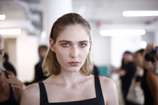 model getting ready backstage at Tibi