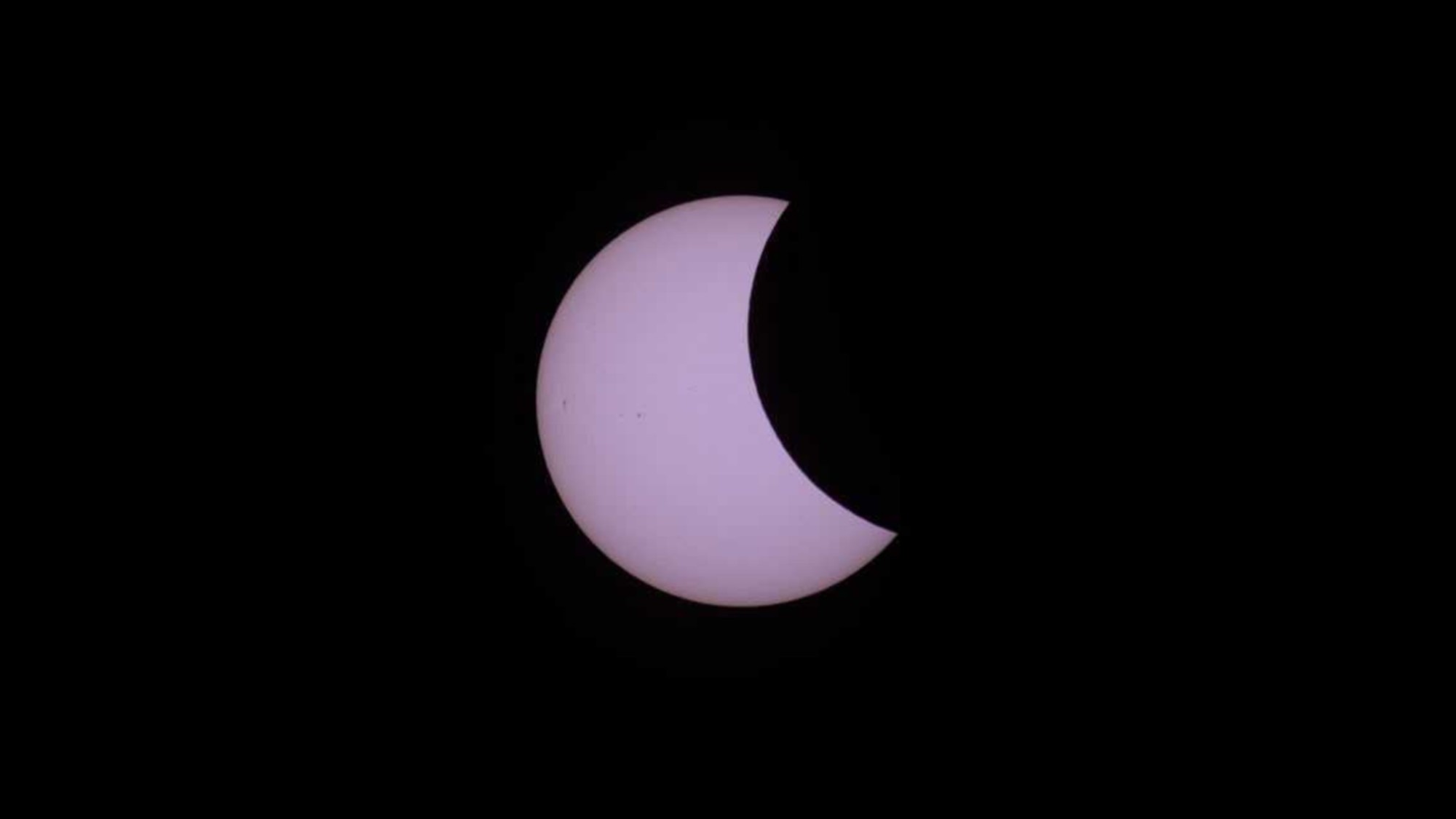 a white crescent on a black background