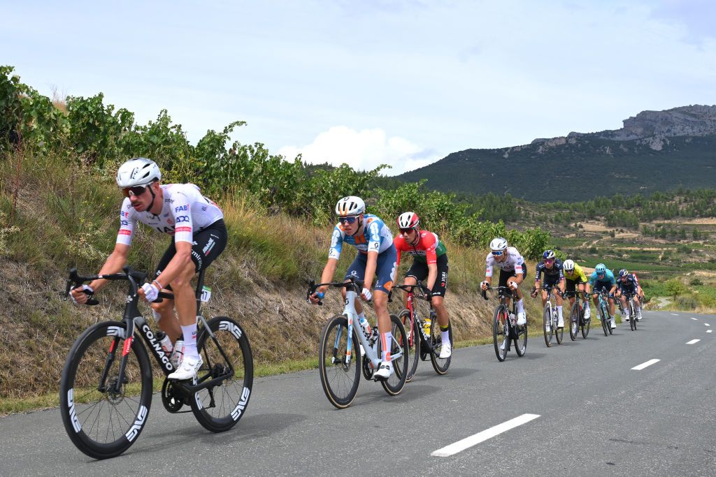 MAESTU PARQUE NATURAL DE IZKI SPAIN SEPTEMBER 05 LR Brandon McNulty of The United States and UAE Team Emirates Pavel Bittner of Czech Republic and Team dsmFirmenich PostNL and Attila Valter of Hungary and Team Visma Lease a Bike compete in the chase group during the La Vuelta 79th Tour of Spain 2024 Stage 18 a 1798km stage from VitoriaGasteiz to Maestu Parque Natural de Izki UCIWT on September 05 2024 in Maestu Parque Natural de Izki Spain Photo by Tim de WaeleGetty Images