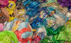 Colourful selection of used foil balloons in a flattened layer 