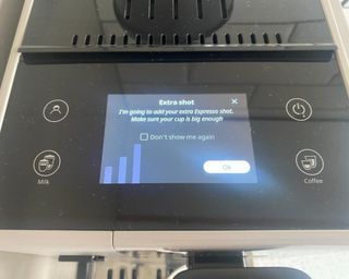 De'Longhi Rivelia coffee maker with screen displaying on how to add an extra shot
