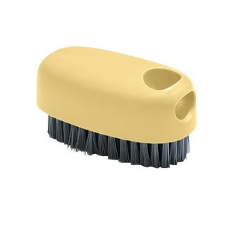 A small, handheld yellow scrubbing brush with black bristles