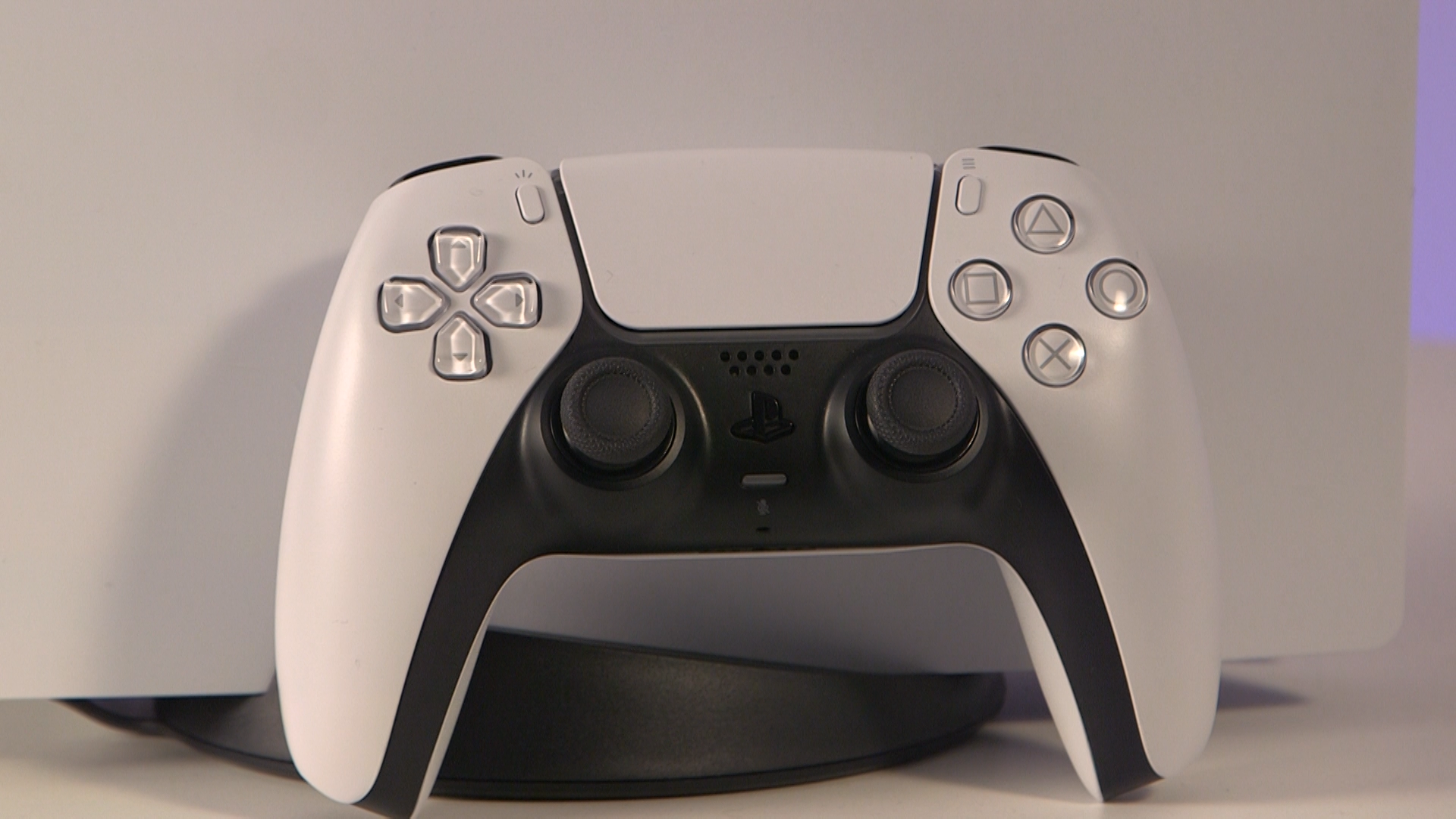 The PS5 DualSense controller leaning against a PS5