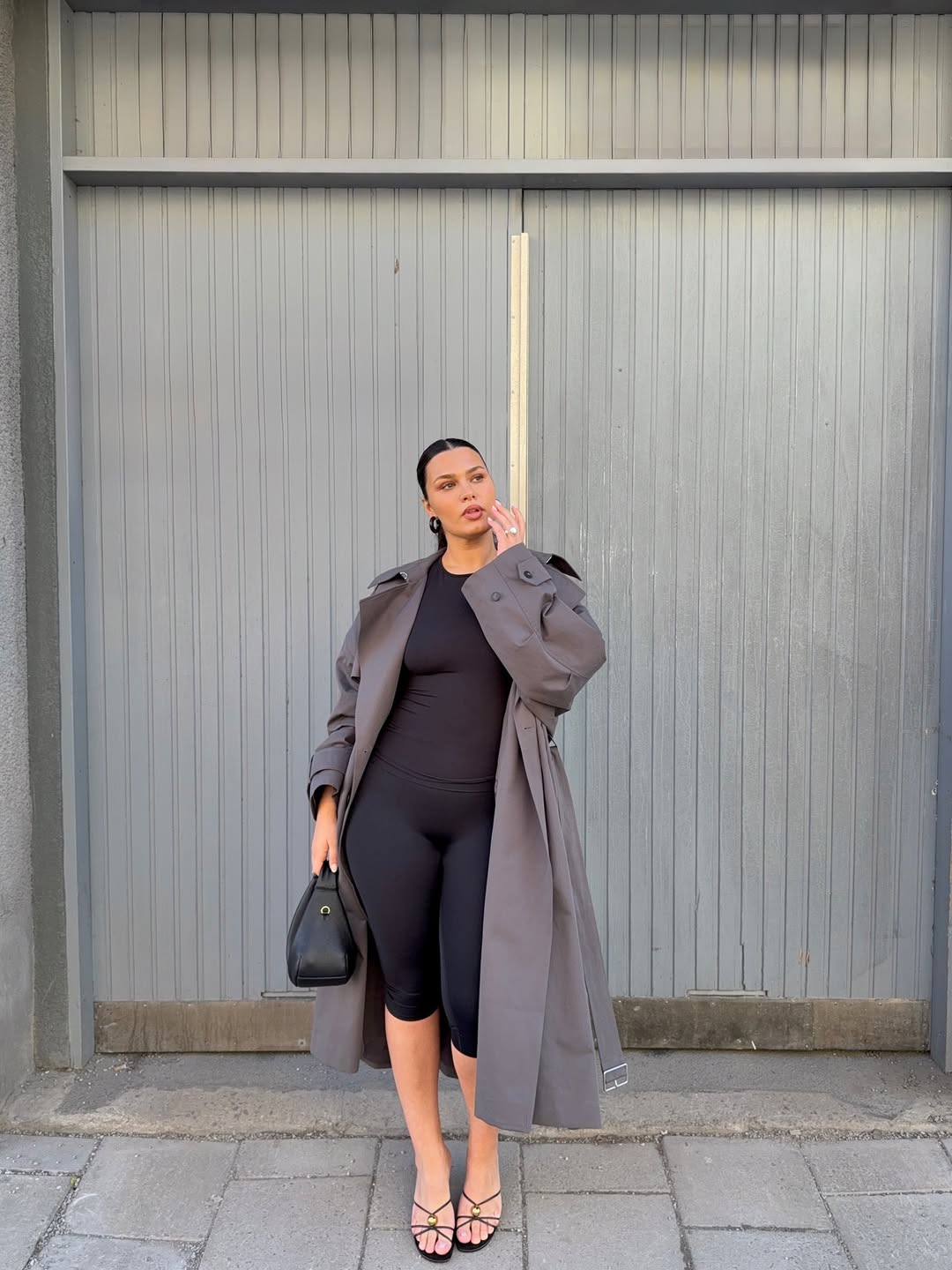 Isabelle in grey trench coat and capris