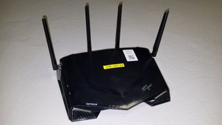 We were expecting an early review model of this router, but the plain white box, no instruction manual, and the yellow label with the code number adorning it indicated that this unit was direct from the Netgear labs, and made us realize that we had arrived at the very bleeding edge of new networking technology.