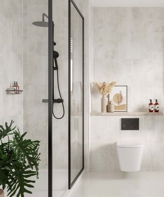 Contemporary bathroom with tile effect wall panels and black hardware in shower