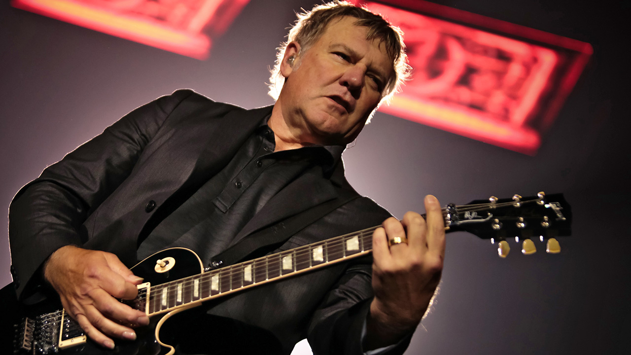 LONDON, UNITED KINGDOM - MAY 24: Alex Lifeson of Rush performs on stage at O2 Arena on May 24, 2013 in London, England. (Photo by Christie Goodwin/Redferns via Getty Images)