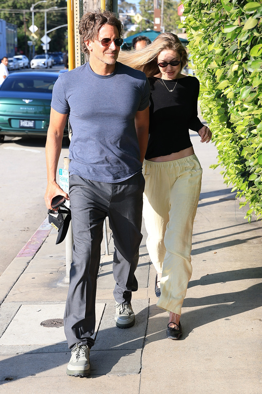 Gigi Hadid wearing a black long-sleeve T-shirt, pale yellow linen pants, and black ballet flats to dinner with Bradley Cooper