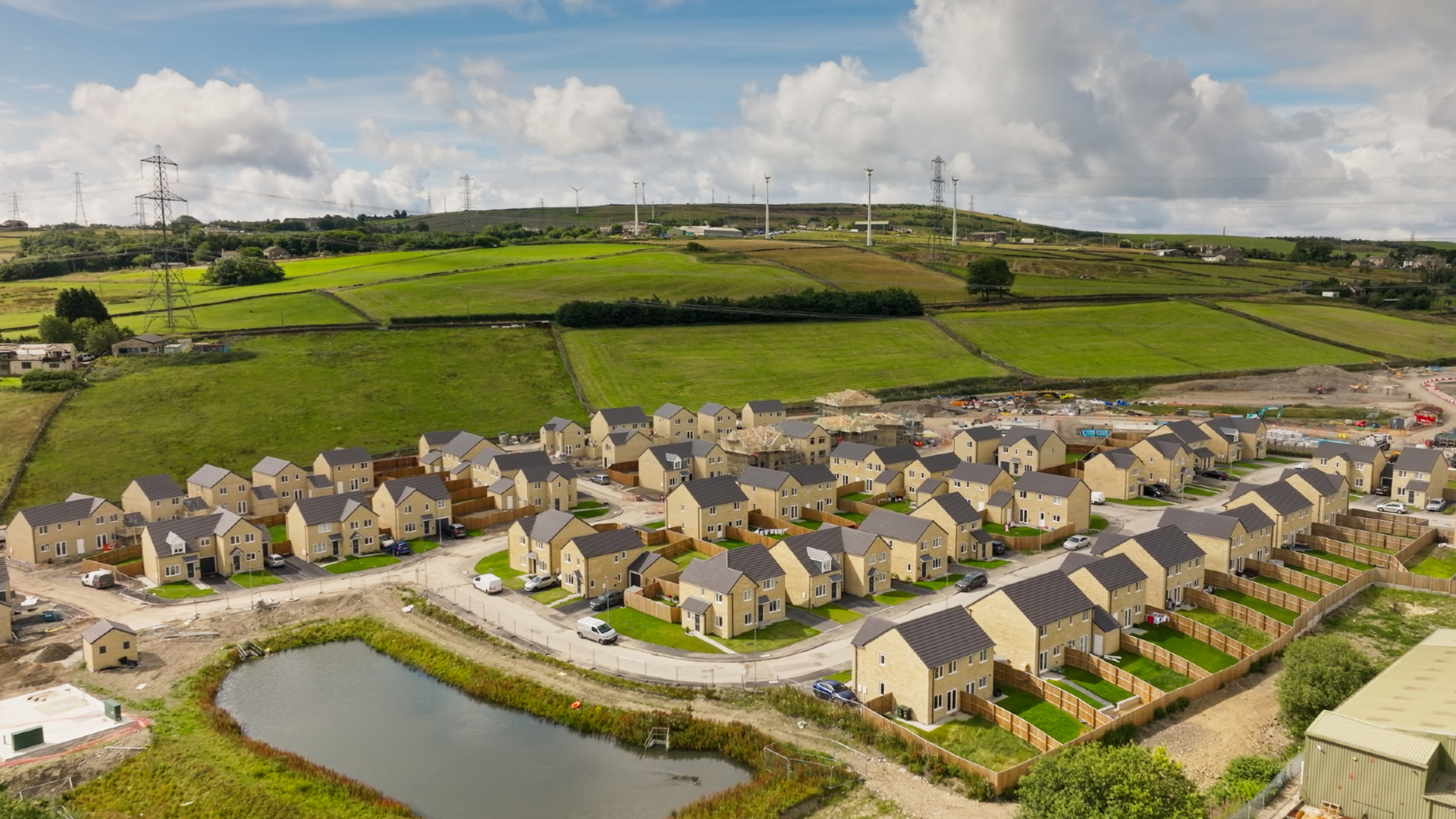 An illustration of an industrial farm next to a neighborhood of houses.