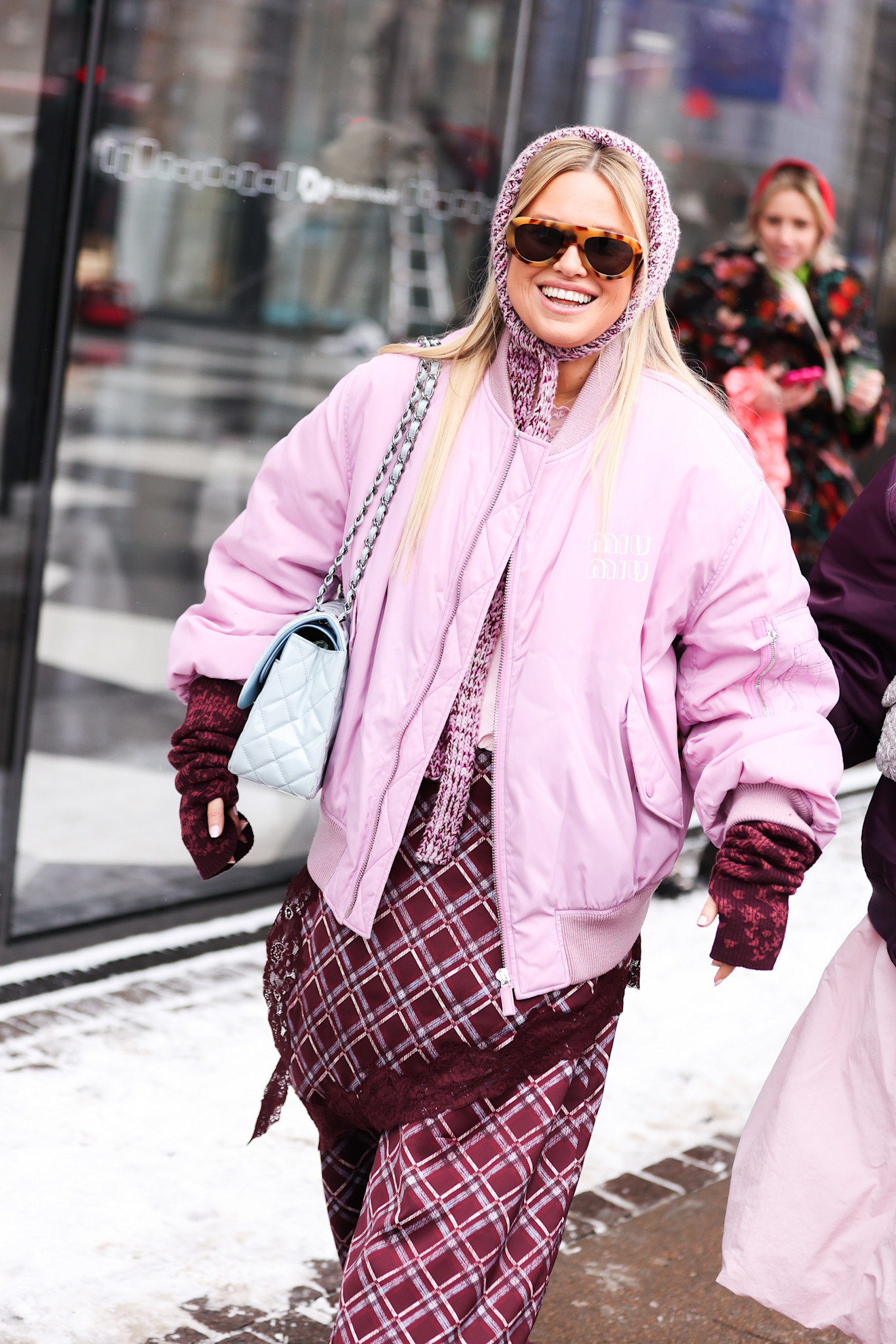guests at Copenhagen Fashion Week Winter 2026 wearing various faux fur and colorful coats
