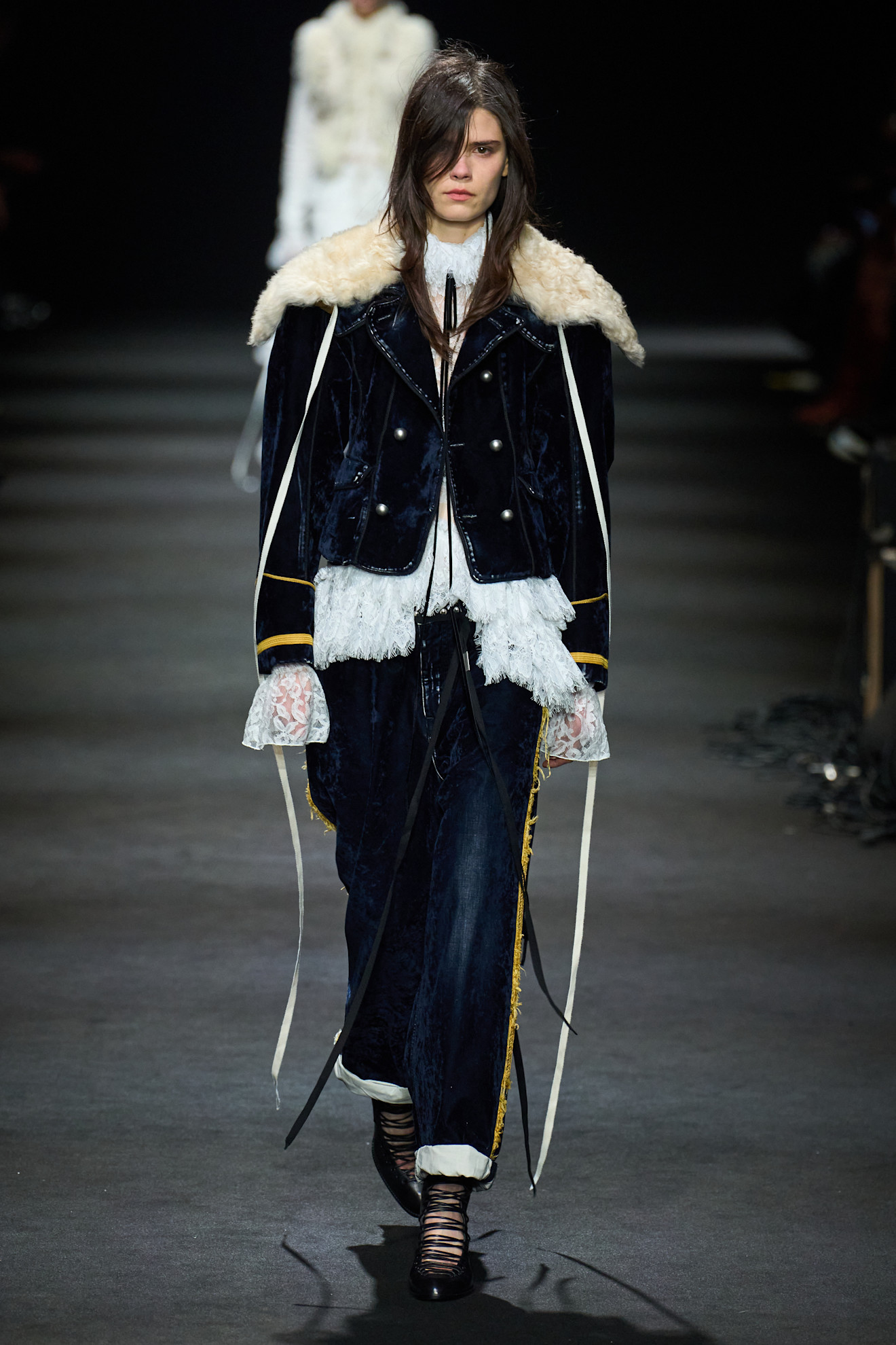 A model wore the military jacket trend on the Ann Demeulemeester Fall 2026 runway
