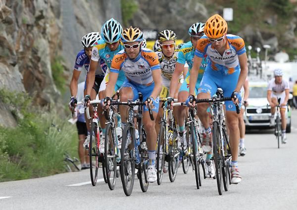 A back group climbs to Alpe d'Huez, over 17 minutes down on the leaders.