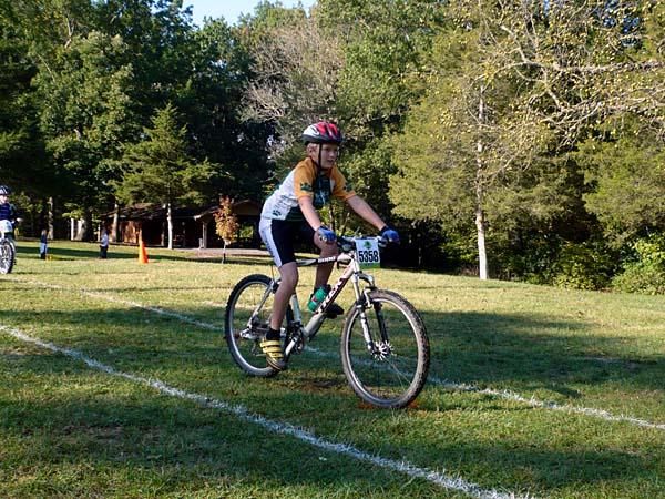 A kid practices his bike handling.