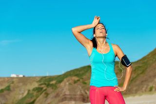 A woman rests after a run.