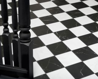 black and white checkered flooring in modern hallway