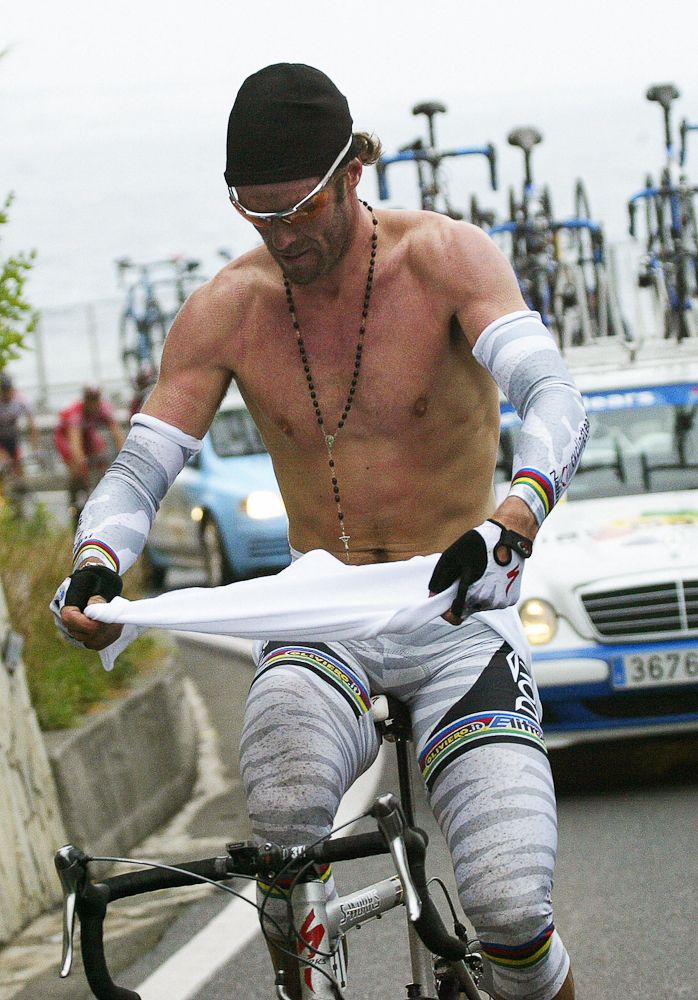 Mario Cipollini (Domina Vacanze) grabs a change of clothing during the 95th edition of Milan-San Remo.