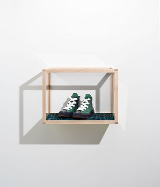 JW Anderson x Converse sneakers sit in a display case