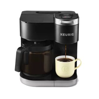 K-Duo Single Serve & Carafe Coffee Maker in black with a white mug