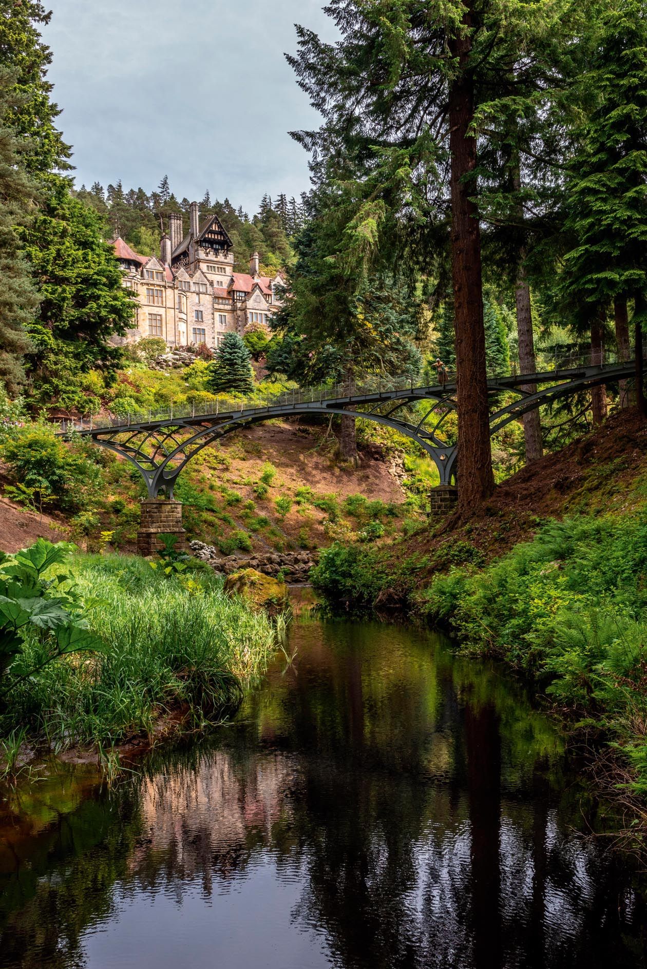 Water flowed through the landscape from artifical lakes to a turbine, which then powered the lights at Cragside (top), the world’s first hydroelectric-powered home in 1878.