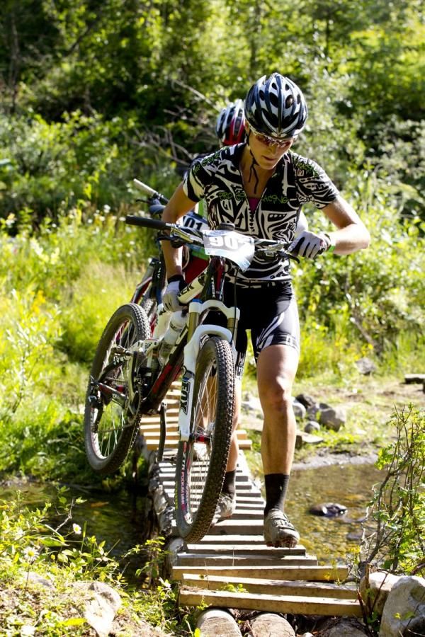 A rider negotiates a makeshift bridge