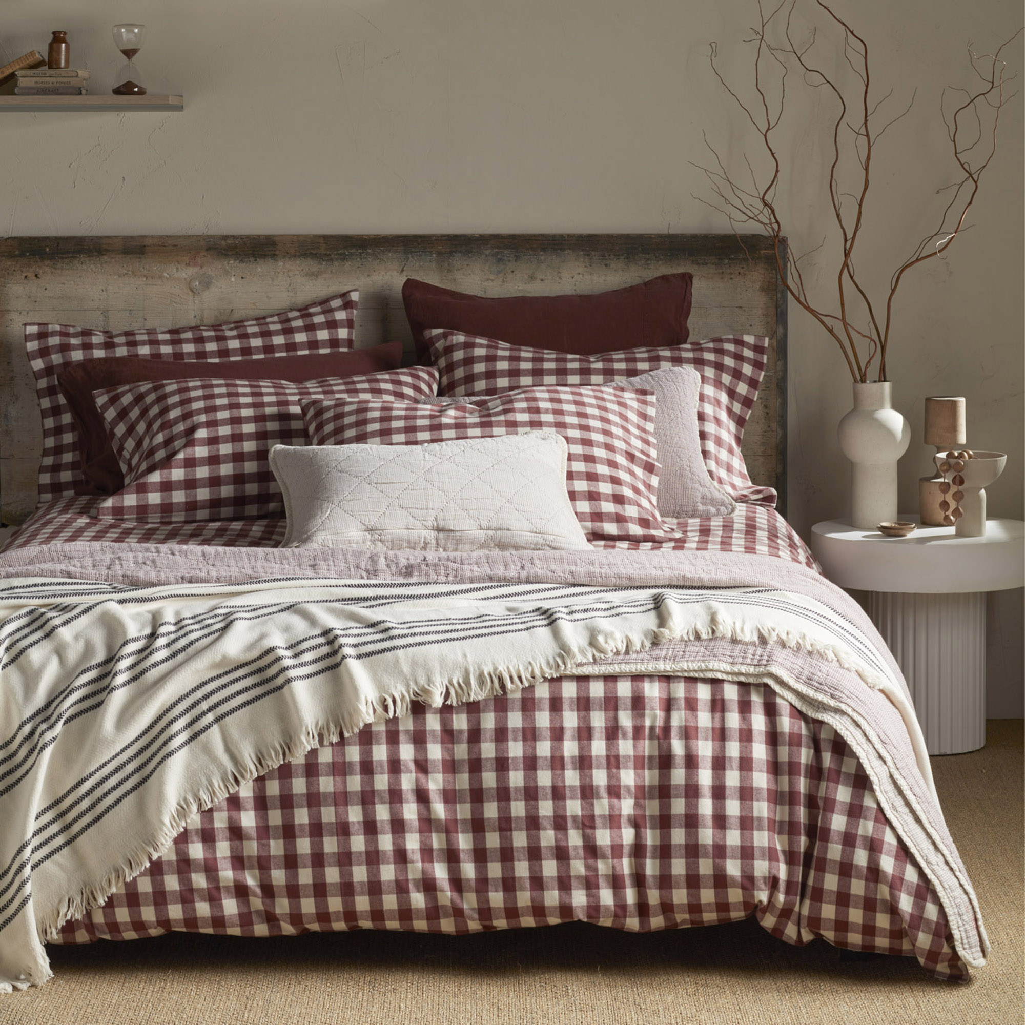 Secret Linen Store's Conker Gilbert Gingham brushed cotton bedding on a bed in a neutral bedroom