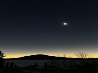 The totality of the eclipse seen over a rural landscape