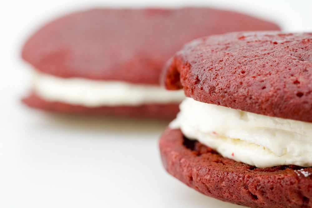 Two red velvet whoopie pies.