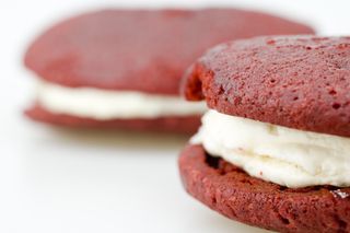 Two red velvet whoopie pies.