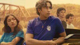 The cast of Motorheads posing against a car and a sepia tone background.
