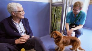 Paul O'Grady at Battersea with handler Ben and Cavalier King Charles Spaniel, George.
