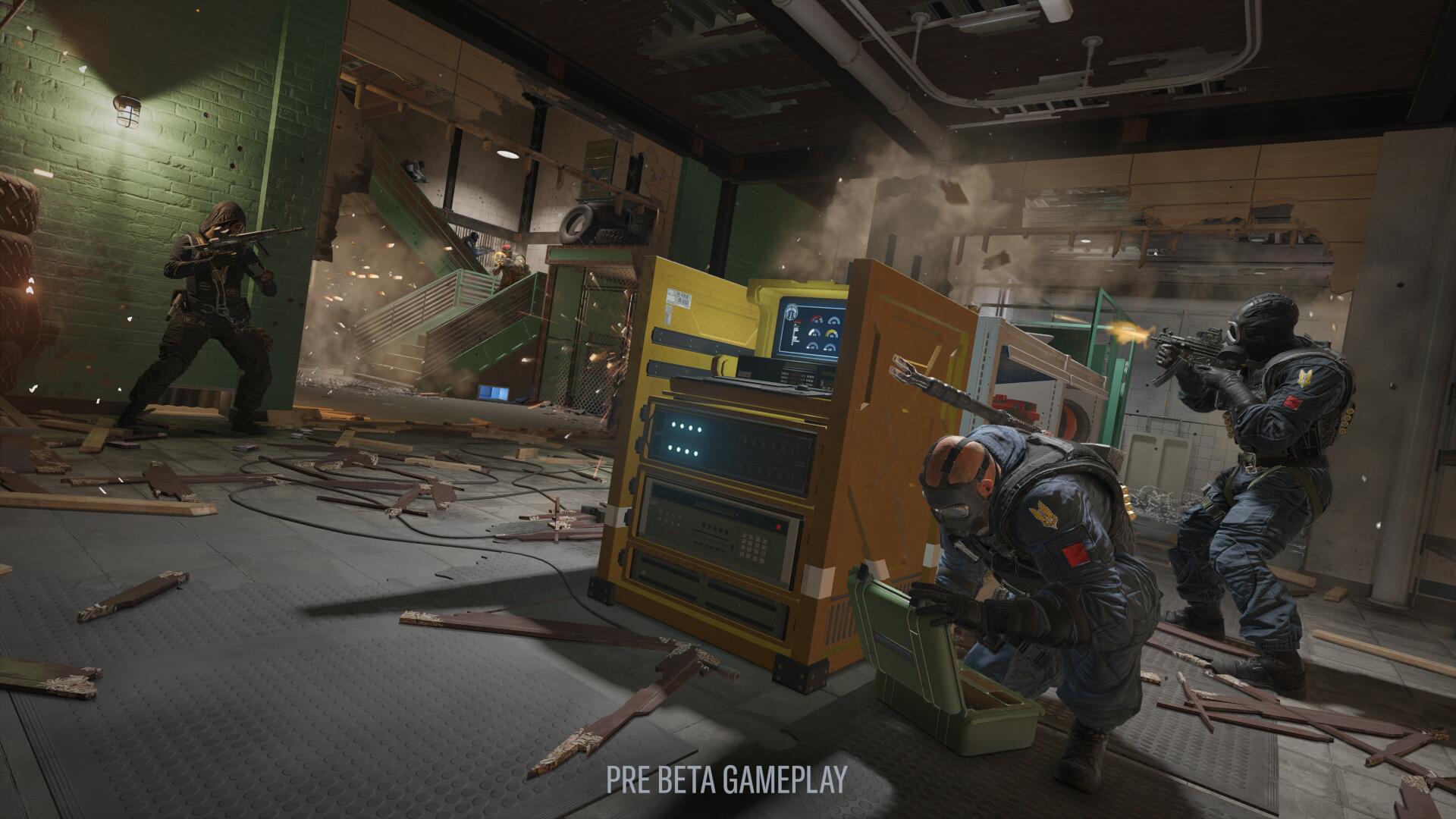 A player attempts to hack a device in Tom Clancy's Rainbow Six Siege X during Dual Front mode as the rest of the squad provide cover, within the District map