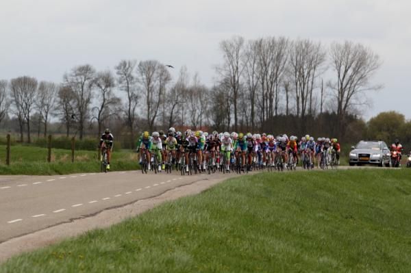 The bunch reached the narrower, country lanes and turned into the headwind