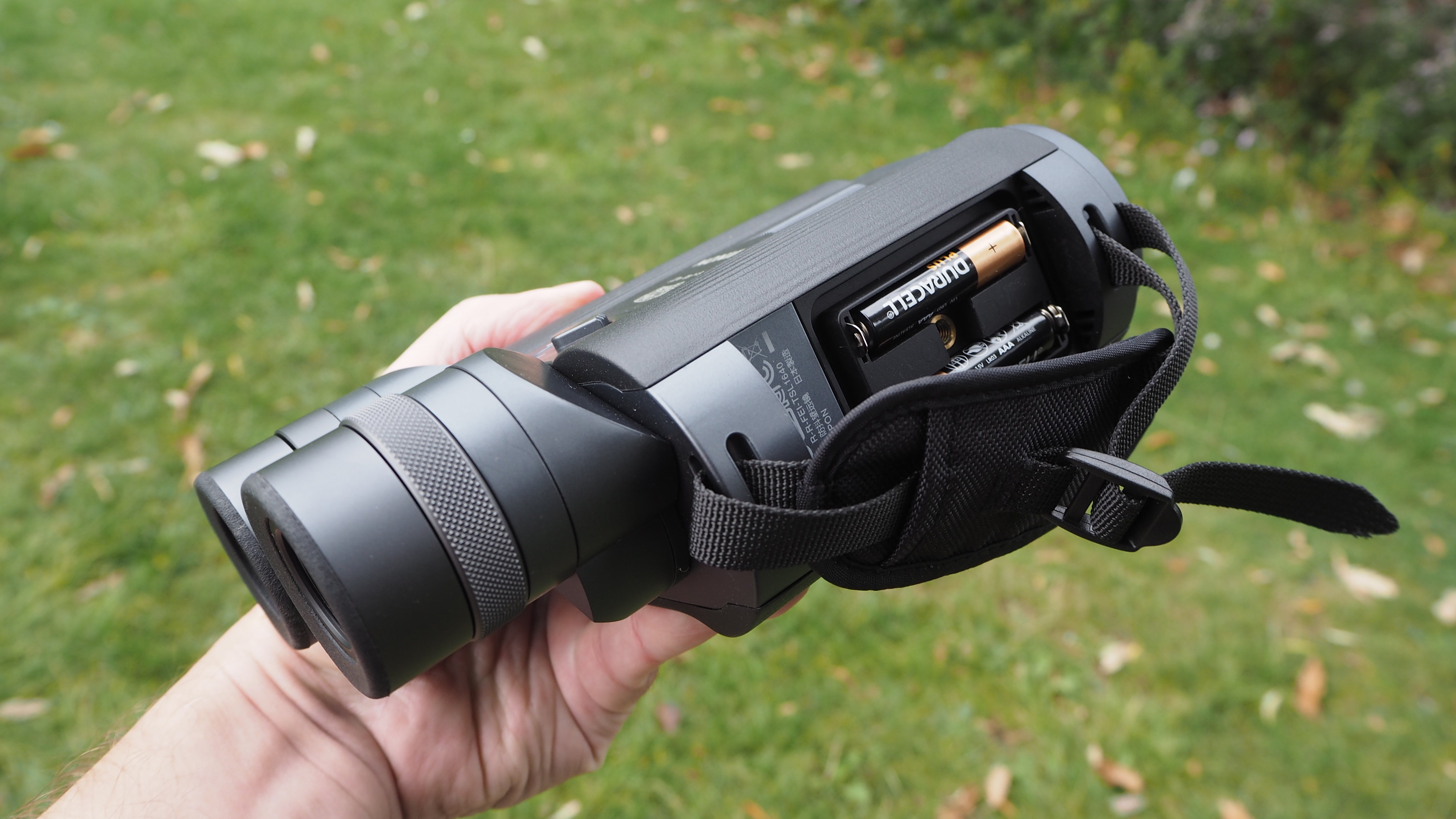 Fujifilm Fujinon Techno-Stabi TS-L 1640 binoculars handheld showing battery compartment