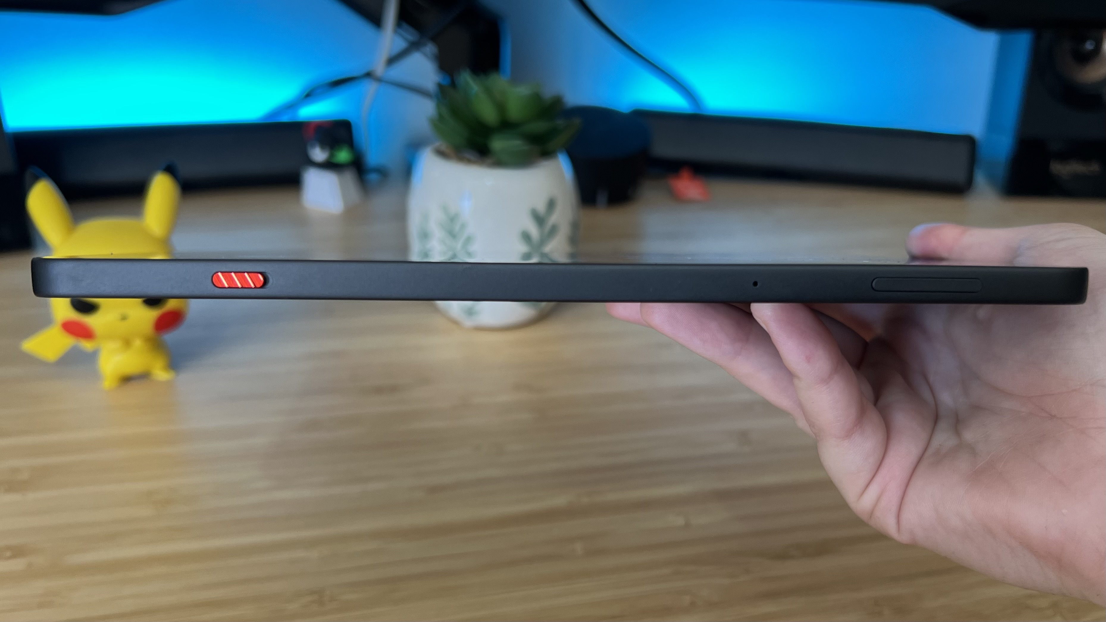 Close up on side of RedMagic Astra gaming tablet being held by a reviewer