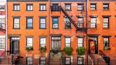 A row of brownstone townhouses in New York City.