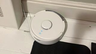 SwitchBot Mini Robot Vacuum K10+ being tested in writer's home