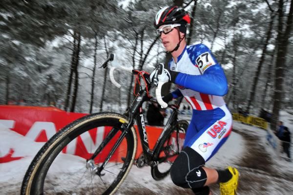 American Zane Godby runs with his bike.