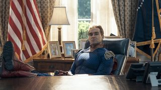 Homelander sitting at the US President's desk in the Oval Office in The Boys season 5 episode 7