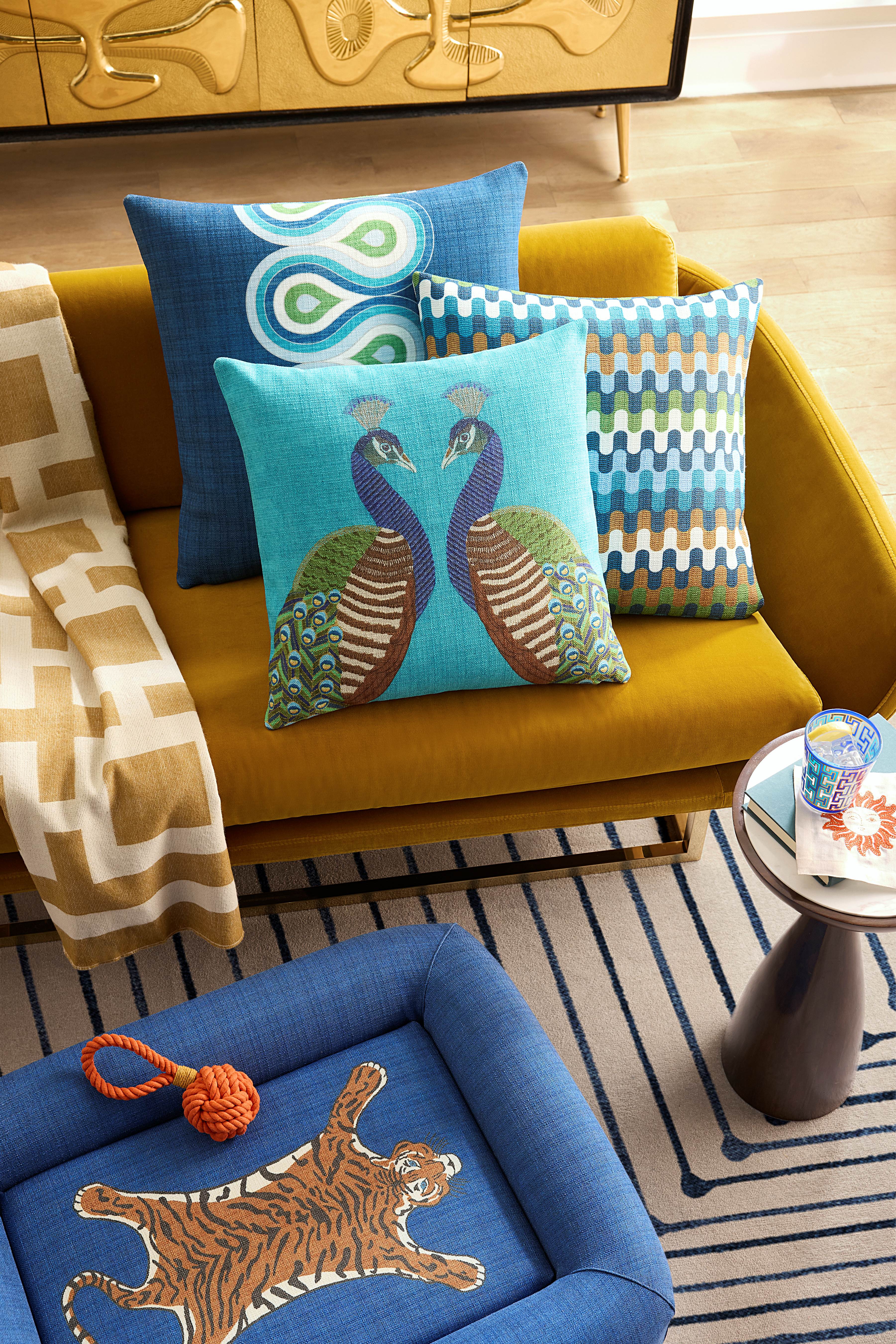 Tiger motif pet bed from Jonathan Adler's Ruggable collection, pictured atop of a geometrically patterned rug