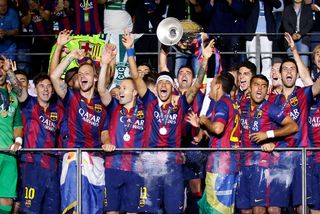 Barcelona lift the Champions League trophy after winning the 2015 final against Juventus