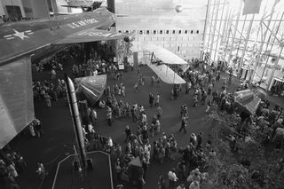 The Milestones of Flight gallery draws a large crowd of visitors in the newly opened National Air and Space Museum, as seen in this photograph taken December 28, 1976.