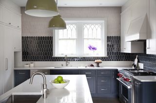 A kitchen window with splashback that reaches to the ceiling and around the window
