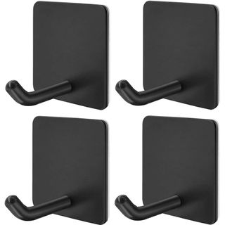 A set of four black stick-on hooks.