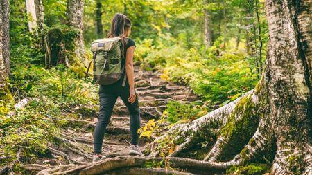 a photo of a woman hiking alone