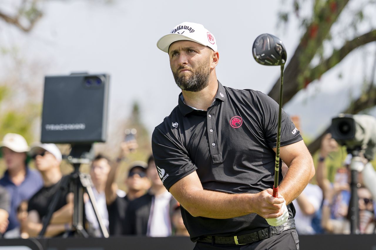 Jon Rahm hits a driver off the tee