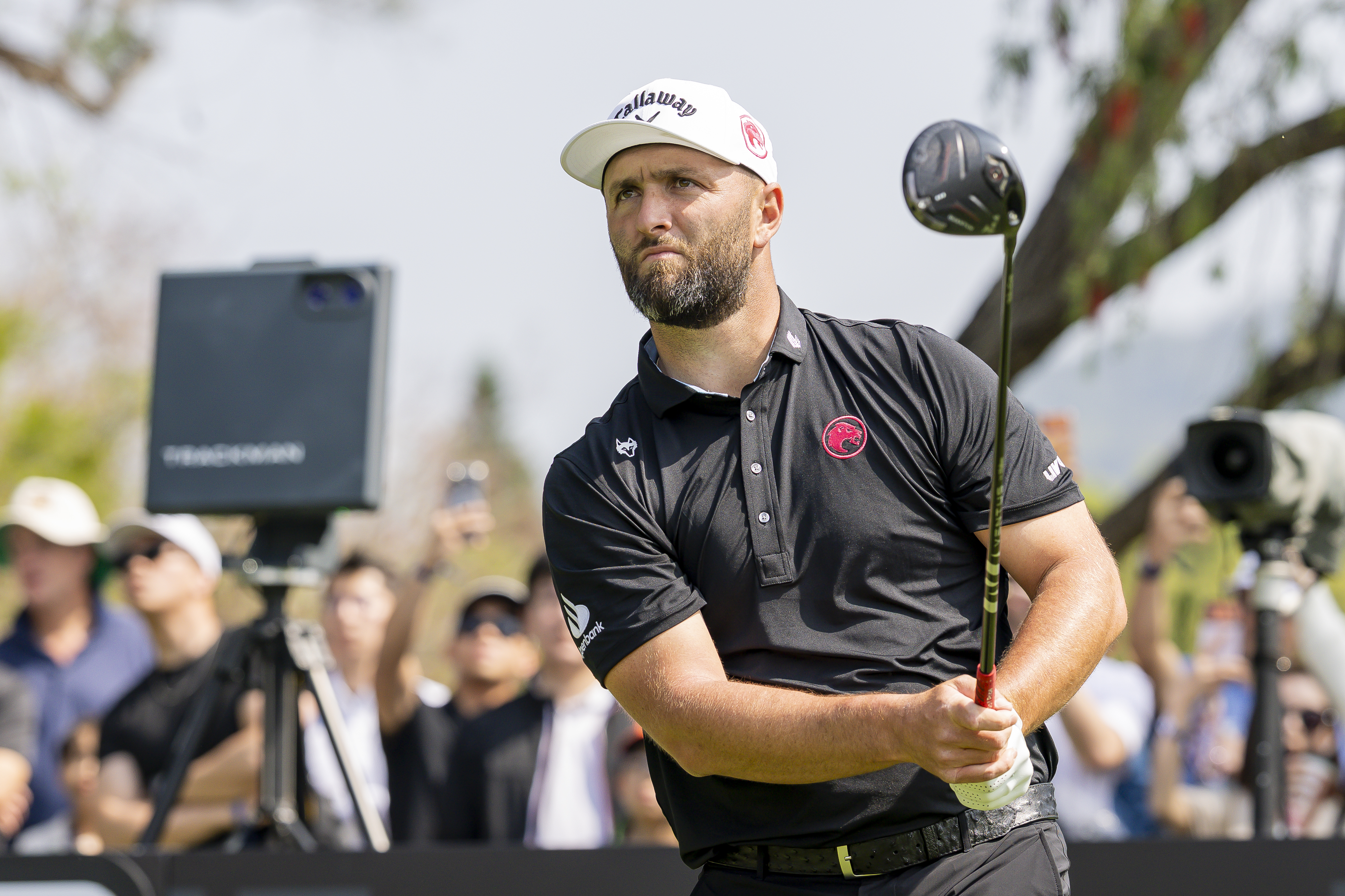 Jon Rahm hits a driver off the tee