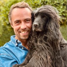 James Middleton holding his dog Zulu
